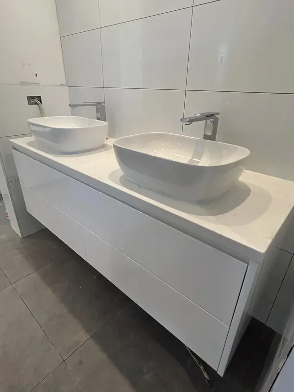 Double vanity with two vessel basins and wall-mounted mixers