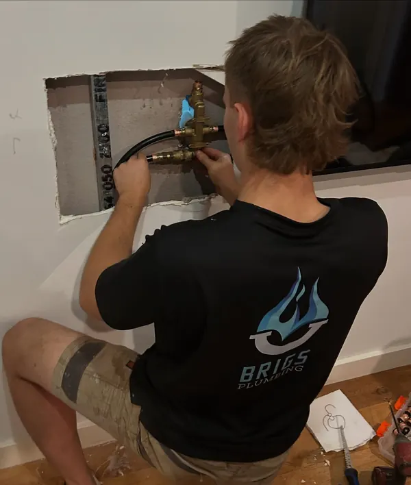 Connecting new copper pipework to a hot water unit through a wall