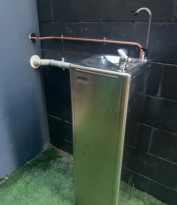 Hot water cylinder with its copper flow and return connections completed