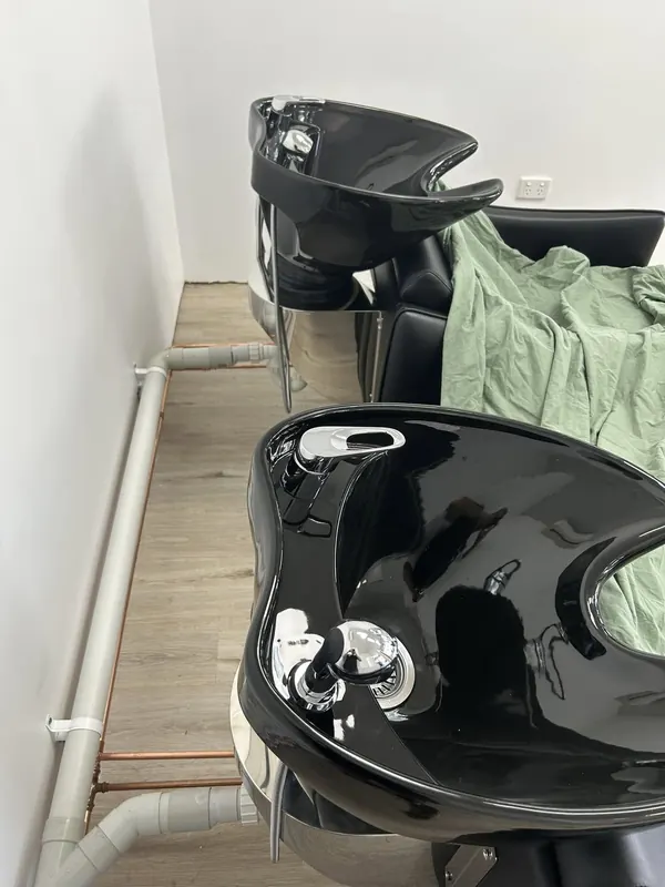 New black laundry tub and cabinet installed and connected