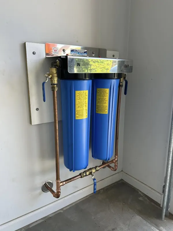 Twin cartridge water filter system plumbed in with copper and isolation valves